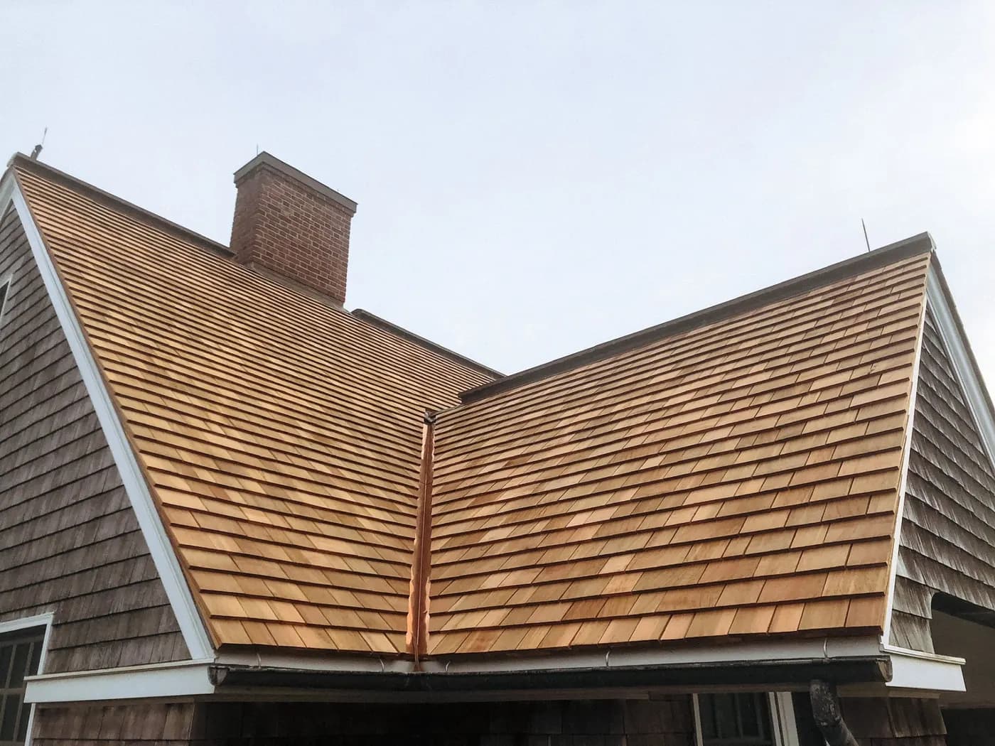 Cedar shake roof and brick chimney detail work — Massachusetts