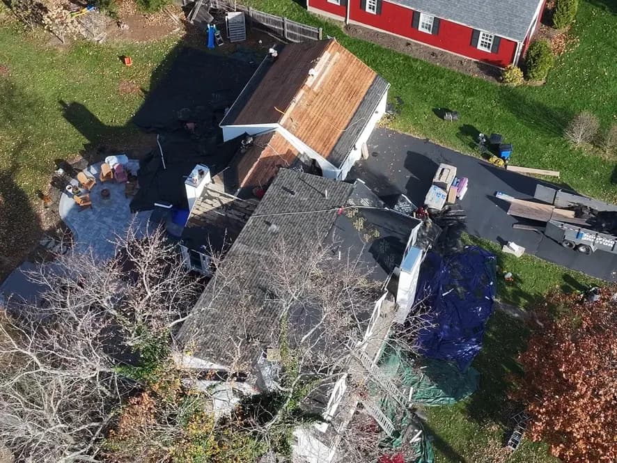 Cedar shake roof with new skylights, aerial view — Massachusetts