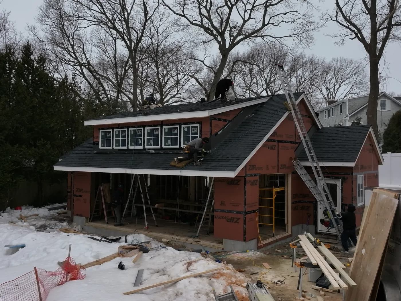 Completed asphalt shingle roof replacement in Massachusetts, aerial view