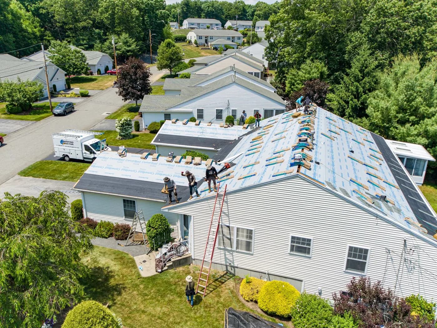 Roofing Doctor crew mid-replacement on a Massachusetts home