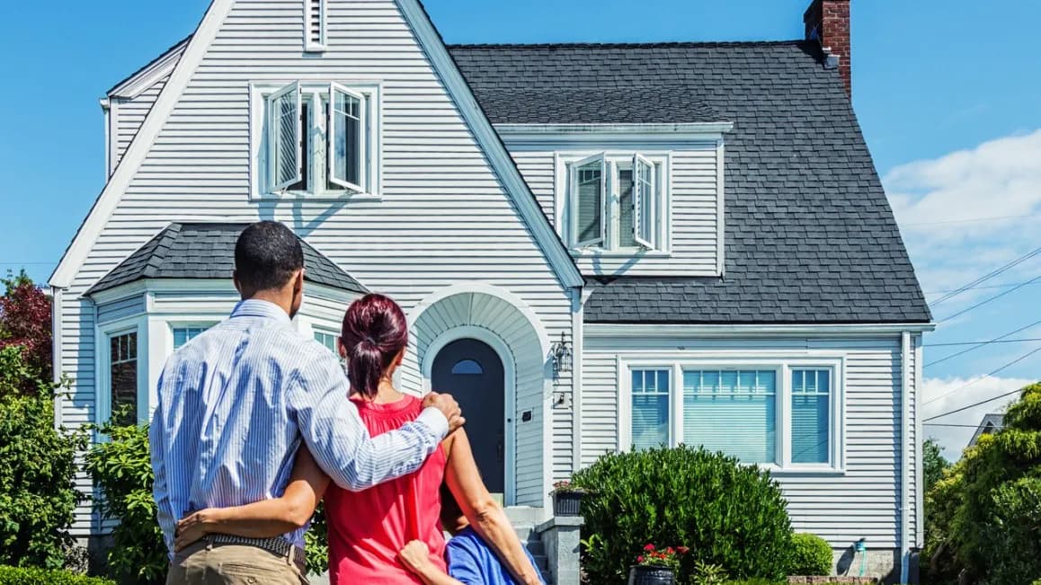 Happy homeowner with roofing contractor