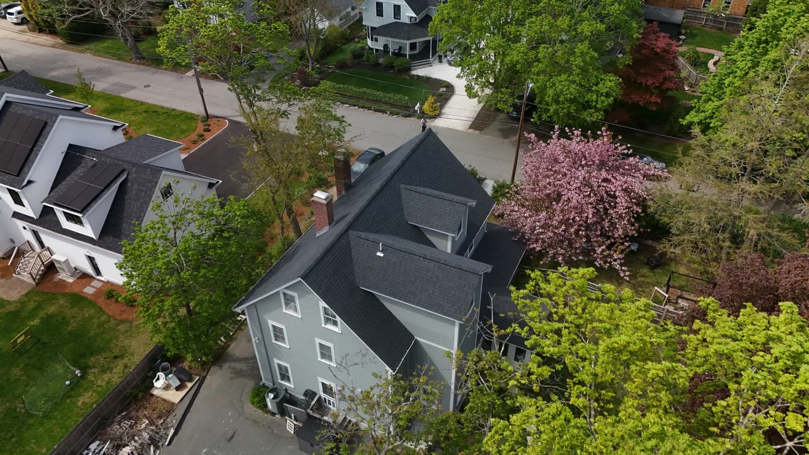 Completed roof replacement by Roofing Doctor, May 2025 — aerial view of new architectural asphalt shingles