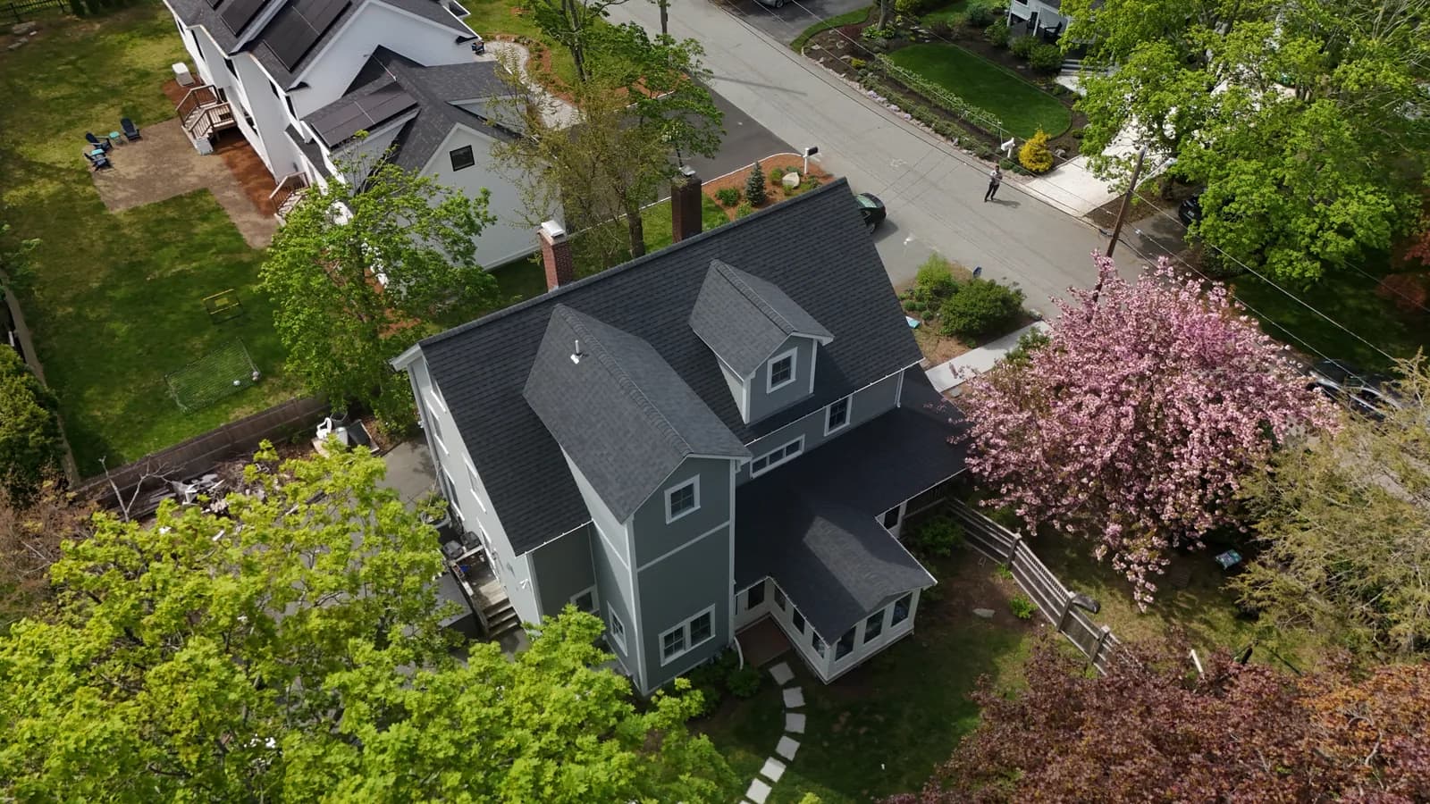 Completed roof replacement by Roofing Doctor, May 2025 — aerial view of new architectural asphalt shingles