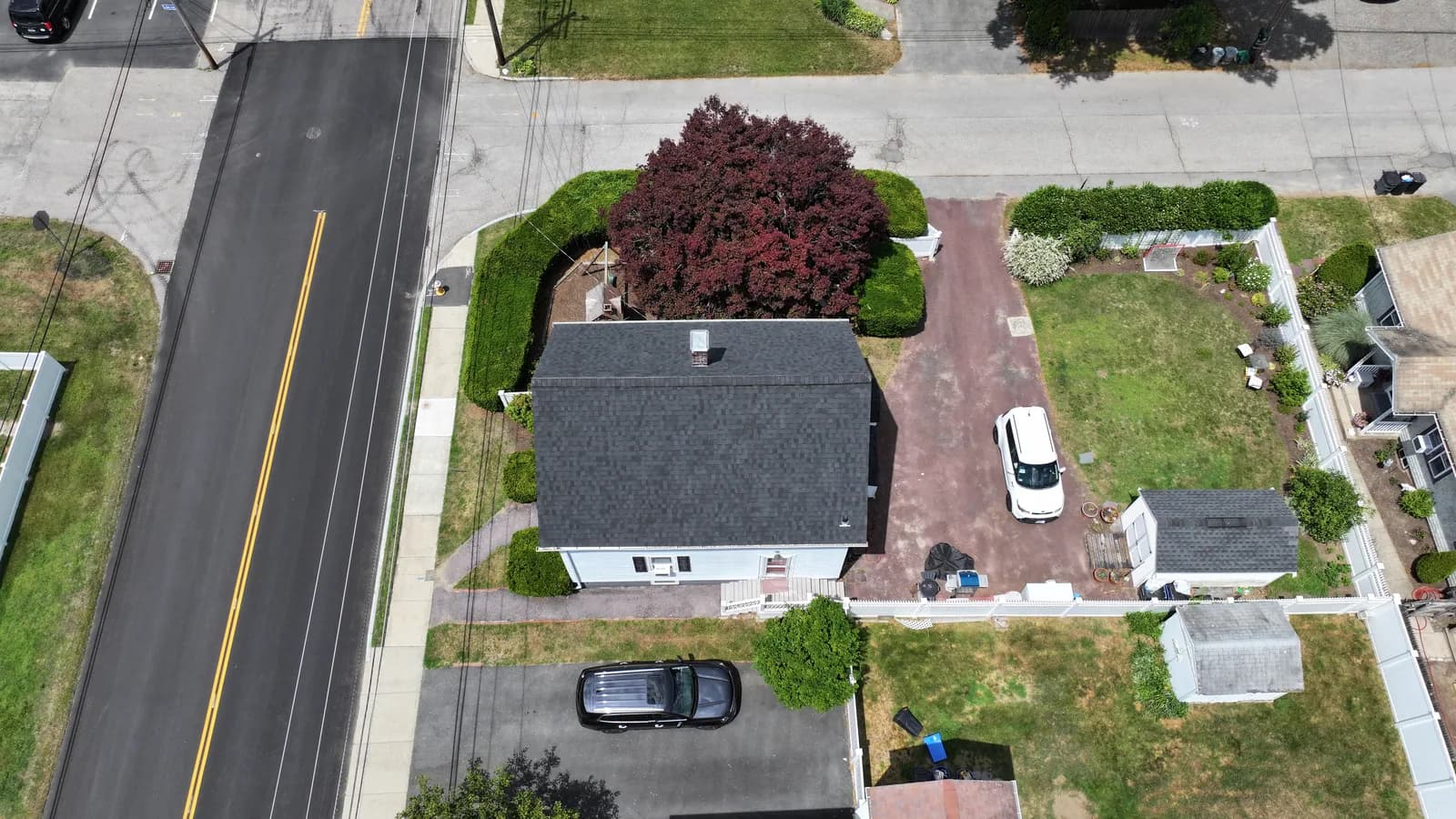 Completed roof replacement by Roofing Doctor, June 2025 — aerial view of new architectural asphalt shingles